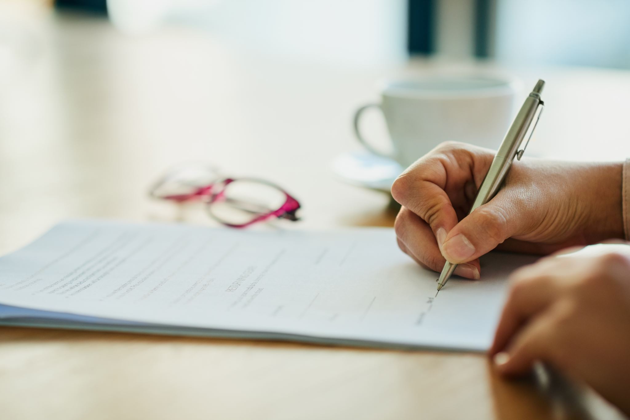 Filling-out-forms-on-a-table